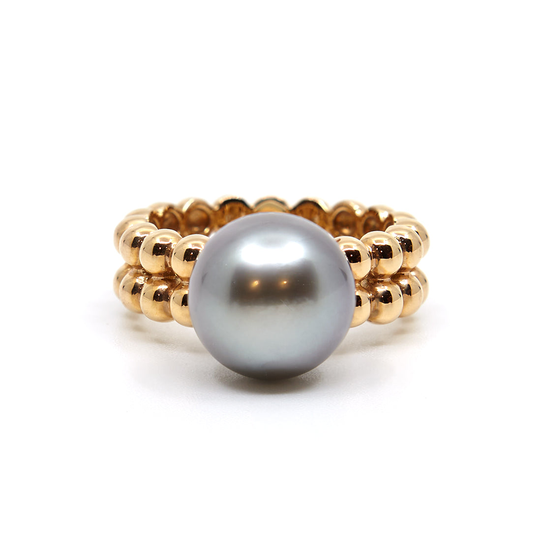 Roségoldener Ring mit Tahiti-Perle und einer Schiene aus Kugeln.