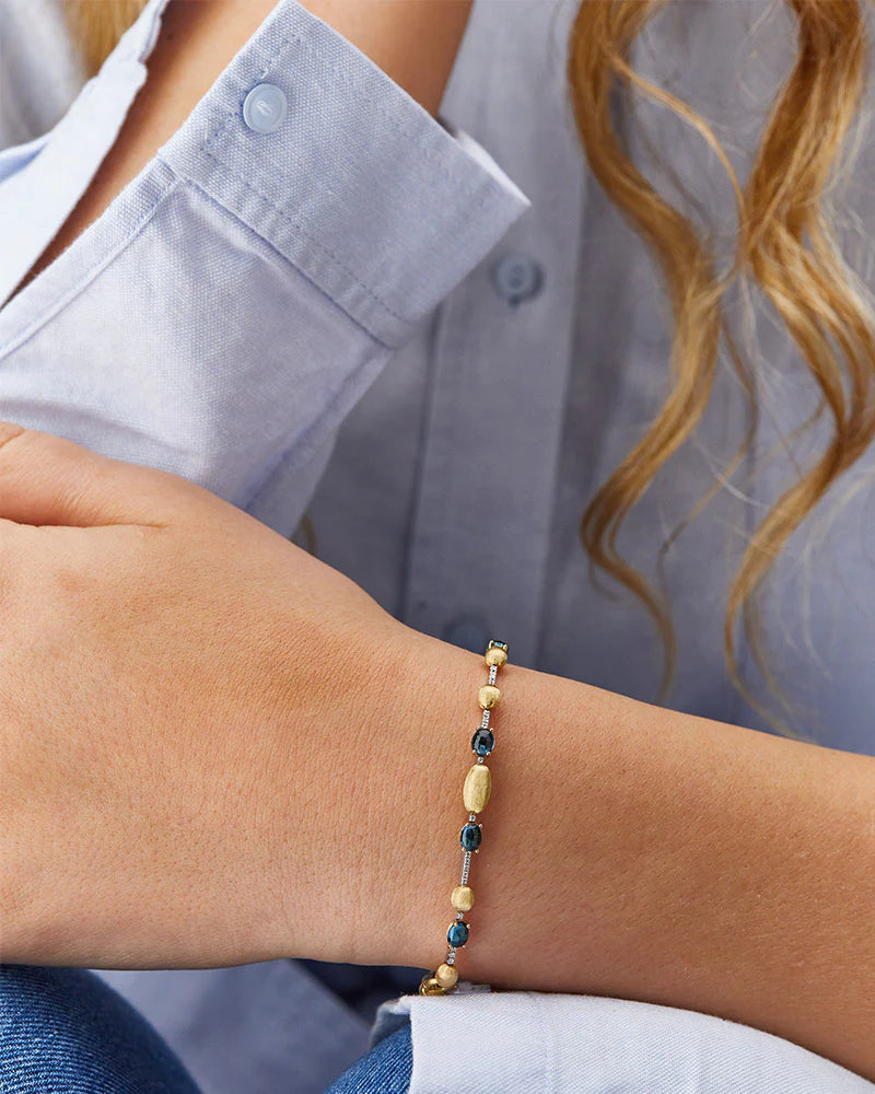 Geelgouden armband met london blue topaas en diamant ''Azure''