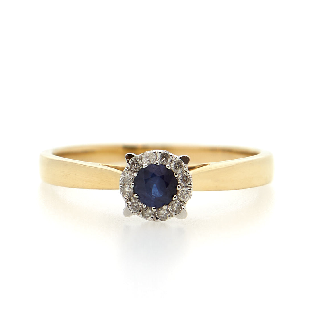 Yellow gold entourage ring with sapphire and diamond.